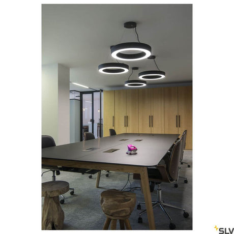 Medo Ring 60 pendant lamp Dali black 3000K in a modern conference room with stylish design