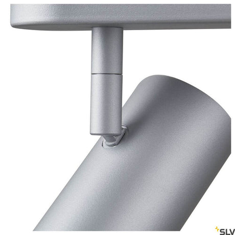 Vue rapprochée du projecteur Noblo LED 2700K gris, montrant la surface laquée grise et le montage.