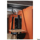 One LED Systemleuchte 3-Phasen Dali Ø 40cm in modernem Design über einem Tisch an einer orangefarbenen Wand.