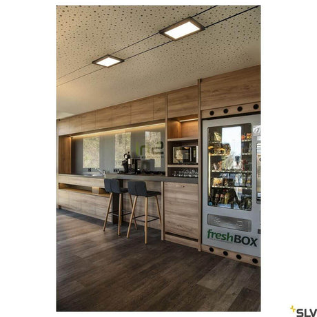 Modern kitchen with Plytta LED cable light for the Tenseo 12V cable system and wood design.