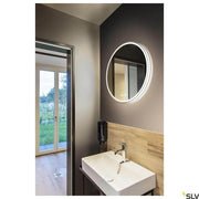 Trukko LED mirror light bathroom mirror Ø 60cm above a modern washbasin in an elegant bathroom.