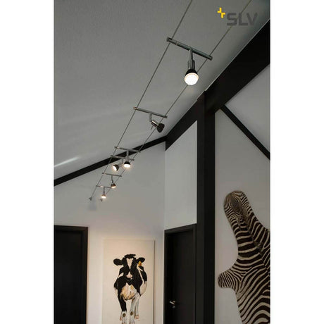 Syros cable light for Tenseo 12V cable system QR-C51 chrome with adjustable spotlight in a modern interior