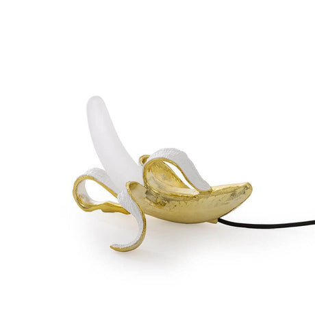 Seletti Banana Huey Tischleuchte aus polierter Bronze, kreative Bananenlampe im modernen Design.