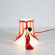 Seletti Circus Lucy Tischleuchte – rote Zirkuslampe mit gestreiftem Lampenschirm und Figur in rotem Abendkleid
