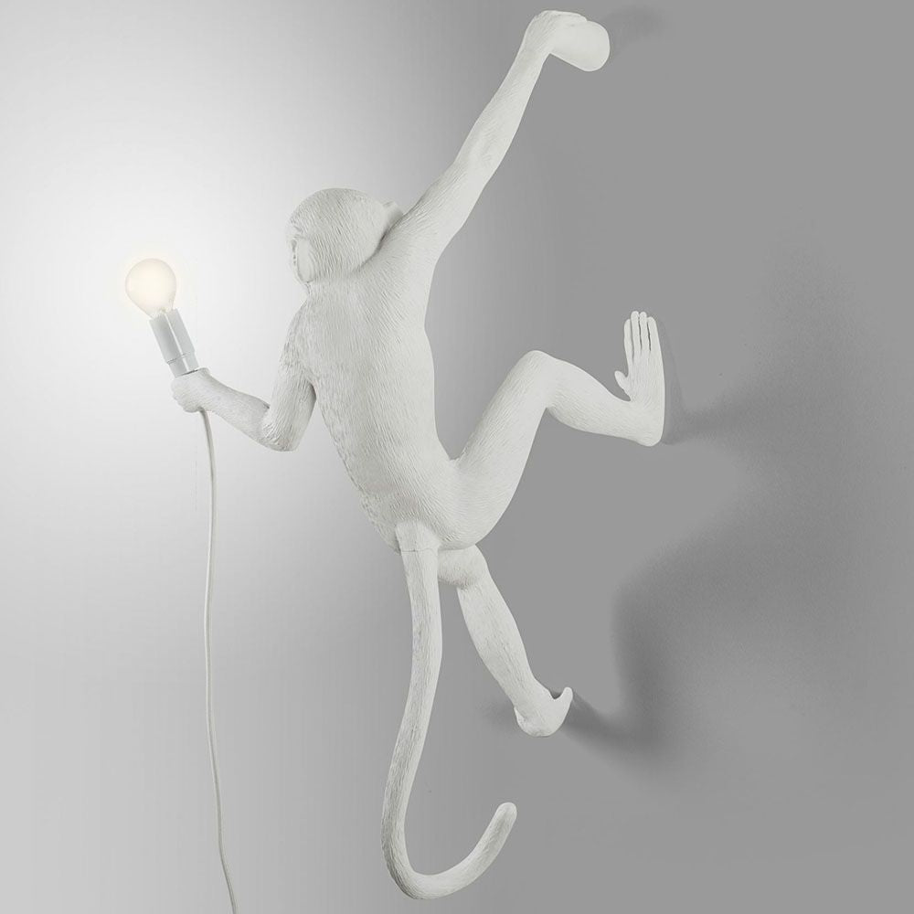 Lampe murale de singe suspendue la main droite blanc