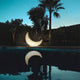 Seletti My Moon Mond Bodenleuchte für Innen- & Außenbereich IP44 am Pool unter dem Sternenhimmel.