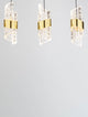 Seneca LED Pendelleuchte Balken 82cm 5-flammig 3000K Schwarz, Gold an einer grauen Wand