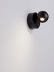Sfera Wandleuchte 3000K Schwarz an der Wand mit modernem Design und schwarzer Oberfläche.