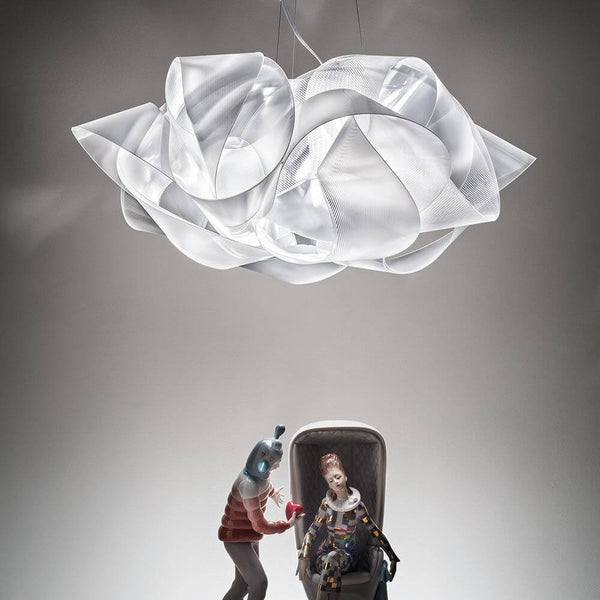 Slamp pendant lamp Fabula Prisma Transparent above a futuristic setting with figures.