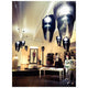 Slamp Hängeleuchte Aria Schwarz, Transparent in moderner Boutique-Umgebung, Betonung auf stilvollem Interior-Design.