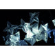 Slamp LED Hängeleuchte Hanami Large 5000lm 2700K Prisma in stilvollem Design mit transparenten Sternen.