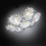 Moderna lámpara colgante Slamp Veli 7 Prisma en un diseño elegante con luz suave y pliegues estilizados.