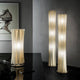 Slamp Stehlampe Bach XXL Gold in elegantem Design, die Raumhelligkeit und Bewegung verleiht.