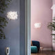 Slamp moderne Wandleuchte Clizia in modernem Wohnambiente mit botanischen Akzenten.