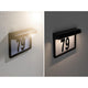 Solar LED Hausnummernleuchte Dayton II Schwarz mit leuchtender Nummer 79 an Außenwand.