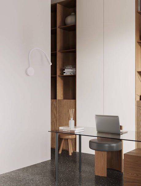 Sonica LED wall light Ø 8.5 cm 3000K IP44 in a modern room with a desk and bookshelf