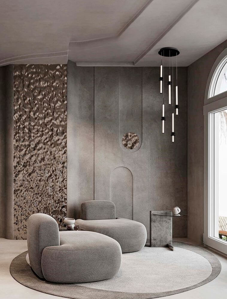 Stylische Stalactite Pendelleuchte im modernen Wohnraum mit grauen Möbeln und minimalistischer Einrichtung.