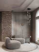 Stylische Stalactite Pendelleuchte im modernen Wohnraum mit grauen Möbeln und minimalistischer Einrichtung.