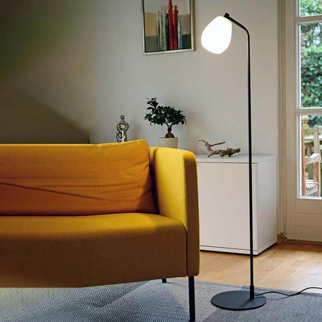 Modern living room design with the Casablanca Bagan floor lamp and a stylish yellow sofa.