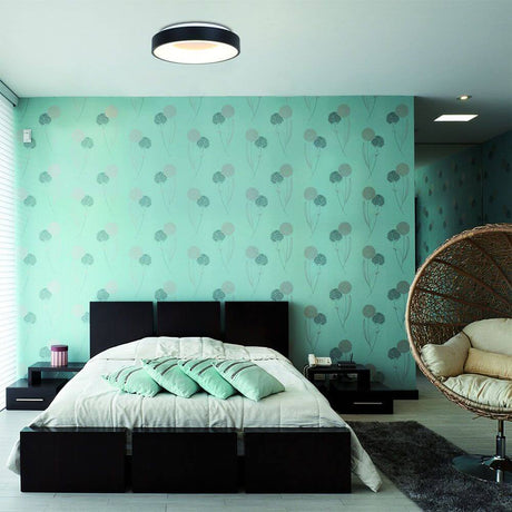 LED-ceiling light Ringlede Ø38cm in a modern bedroom with green wallpaper pattern.