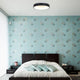 LED-Deckenleuchte Ringlede Ø48cm in einem modernen Schlafzimmer mit blauen Wänden und stilvollem Bett.
