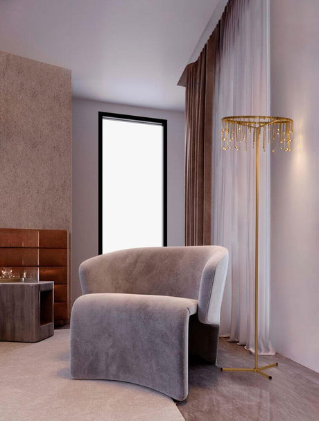 Stellar LED floor lamp H 141cm Ø 40cm 3000K next to a modern grey armchair in a stylish room.