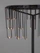 Stellar LED Tischleuchte H 46cm Ø 30cm 3000K, detail view of elegant lamp design with hanging lights.