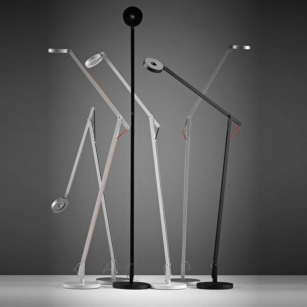 Rotaliana String LED floor lamp with Push Dimm to Warm Silver in an elegant, flexible positioning against a neutral background.