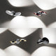 Lodes Nautilus LED Wandlampe 2300 Lumen in verschiedenen Designs an der Wand montiert.