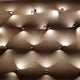 Lodes Nautilus LED Wandlampe 2300 Lumen in elegantem Design, installiert an einer dekorativen Wand.