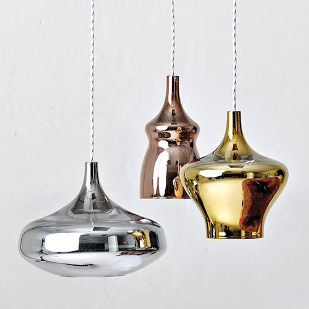 Moderne Pendelleuchten in Edelstahl, Kupfer und Gold für elegantes Interior-Design.