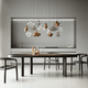Lodes Nostalgia Glass Medium LED Hängeleuchte in modernem Esszimmer mit eleganten hängenden Lampen.