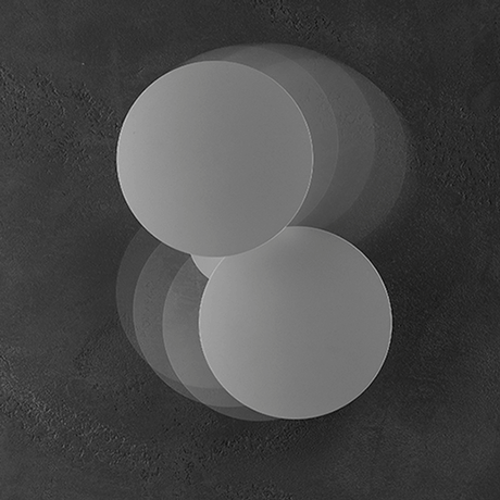 Lodes Puzzle Round Outdoor Double LED wall light in a unique design with circular elements.