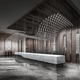 Moderne Empfangshalle mit Lodes Rain LED Hängelampe, eleganter marmorierter Empfangstresen und stilvolles Design.