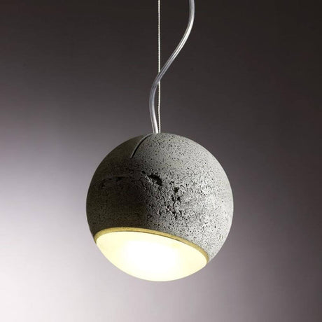 Tecnolumen betongpendellampe Trabant 1 dreibar med linse, svevende betongkule i moderne design.