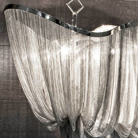 Terzani Atlantis Designer-Hängelampe mit schimmerndem Metallband und eleganter Lichtquelle.