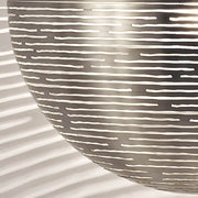 Detail of the Terzani Magdalena designer pendant light hemisphere with laser-cut openings.