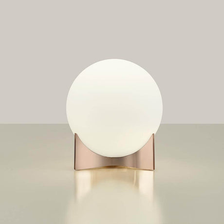 Terzani Oscar design table lamp with a round white lampshade and a glossy rose gold base.