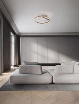Moderne Tilia LED Deckenleuchte im zeitgenössischen Raum über einem Sofa in Farben Nickel und Mocca Coffee.