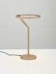 Tilia LED Tischleuchte Ø 22cm 3000K in Sandy Black mit modernem Design auf einem Tisch.