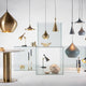 Tom Dixon Beat Round Hängelampe 4er Ø 85cm aus massivem Messing in einem modernen Interior-Design-Setup.