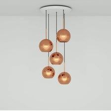 Tom Dixon Copper 5er Pendelleuchte Ø 25cm mit hochreflektierenden Kupfer-Lampenschirmen.