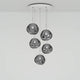 Tom Dixon Melt Mini Pendelleuchte mit 5 leuchtenden Kugeln in modernem Design, ideal für stilvolle Raumbeleuchtung.