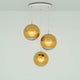 Tom Dixon Mirror Ball 40cm 3er Pendellampe in goldenen Farben mit reflektierenden Oberflächen.