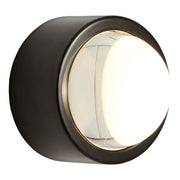 Tom Dixon Spot wall light with glass lens in matt black and thick glass lens, ideal for wall or ceiling installation.