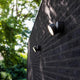 Trumpet L 90° schwenkbare LED-Außenwandleuchte IP54 Anthrazit an einer Wand im Garten.