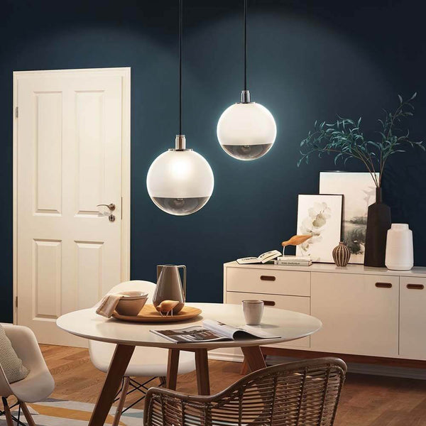 URail 2Easy Basic pendant max. 20W E27 Black above a dining table with modern interior design.