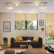 URail Ceiling Topa Dot 1x5,2W Chrom Klar Satin 230V im modernen Wohnraum mit Sofa und Fenstern