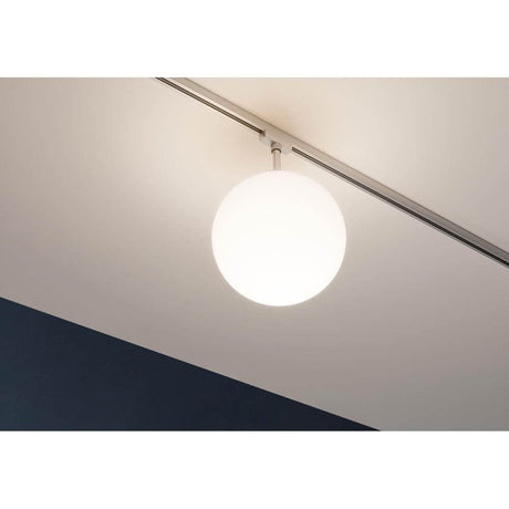 URail Spot Ceiling Globe Small E14 above a modern ceiling in a stylish room.