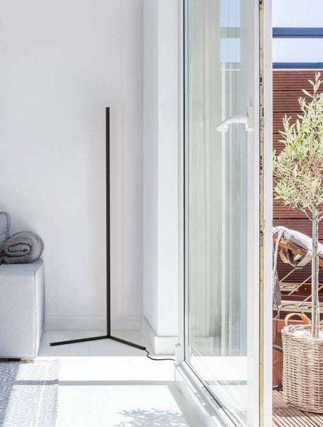 V-Line LED floor lamp H 140.5 cm 13000K in black, sleek aluminum frame beside window, minimalist floor light in a modern living space